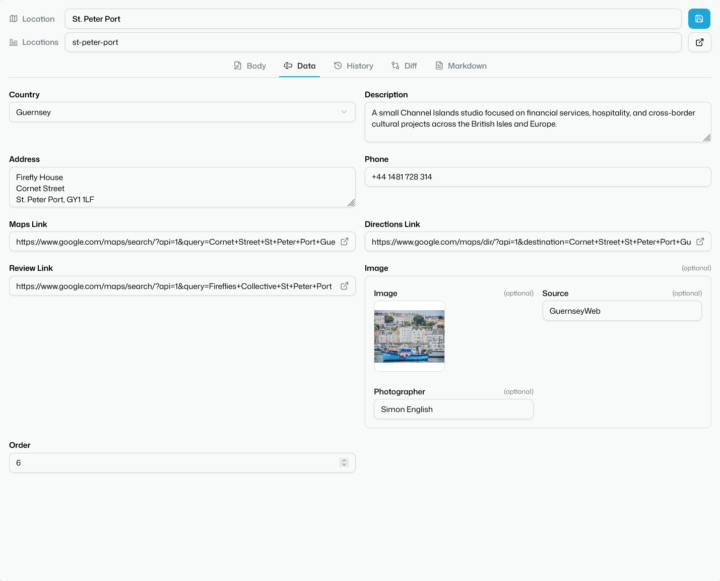The Data tab editing a location entry as labelled fields — country, address, phone, and an image with its photographer credit — instead of raw frontmatter.